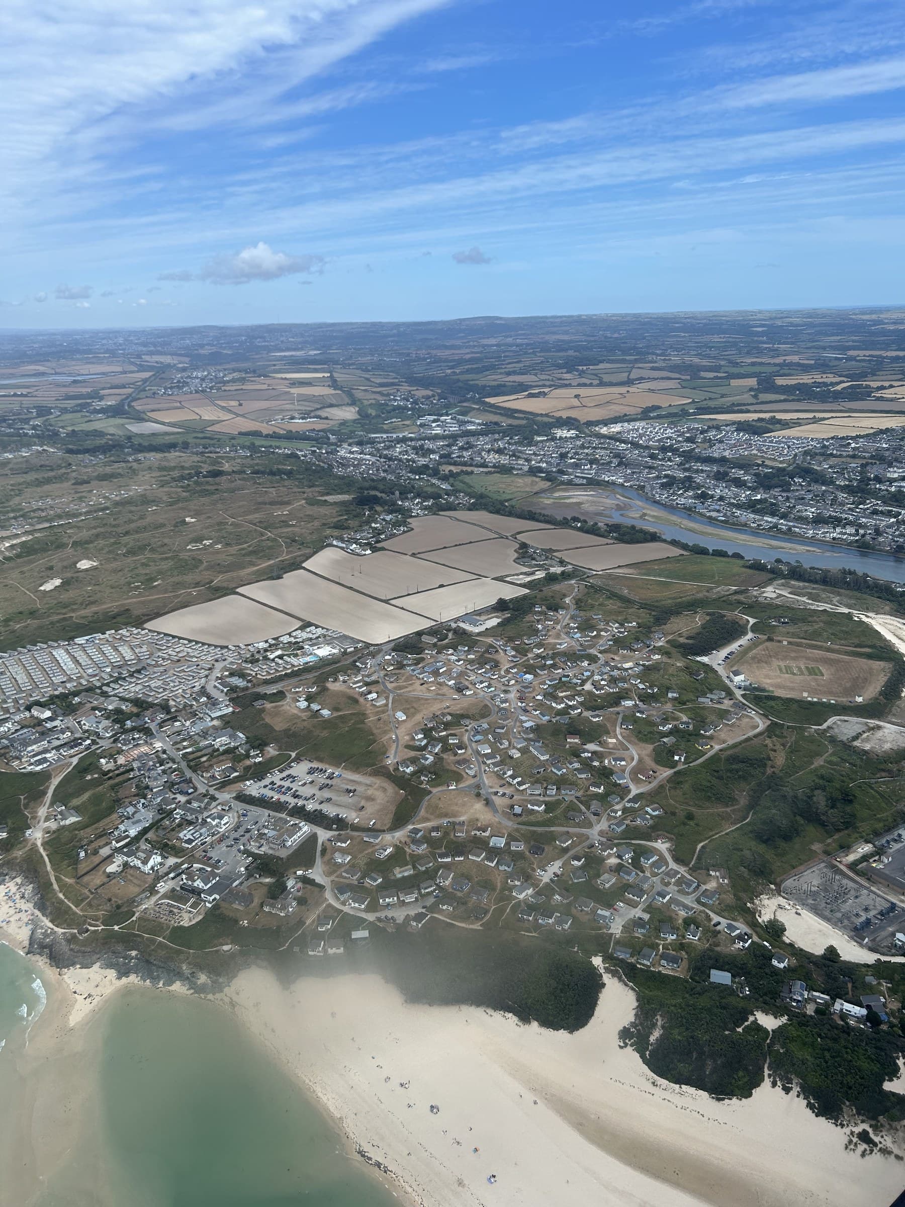 St Ives and its beaches seen from the air, sand dunes and a campsite below