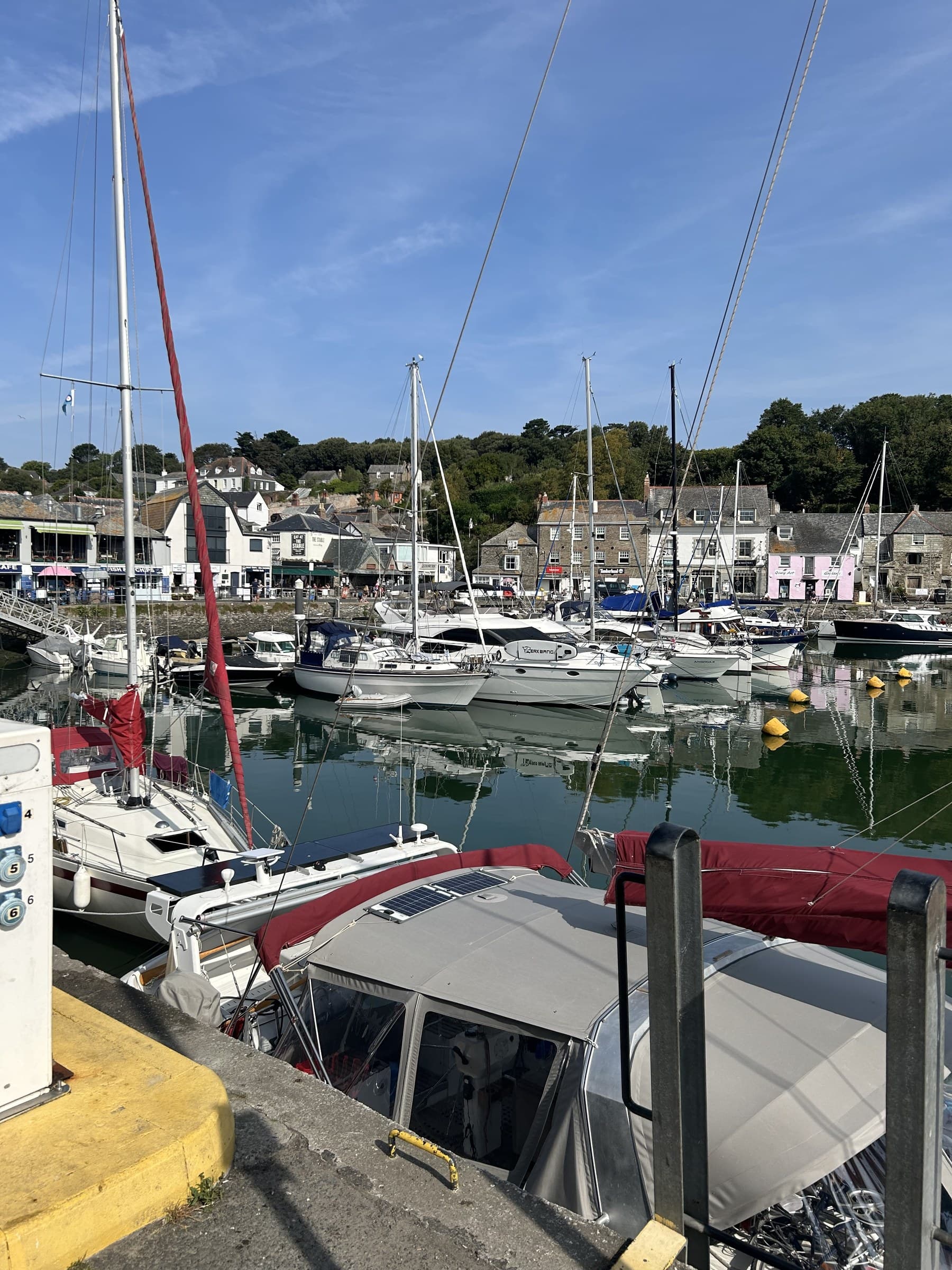 Padstow's harbour, lined with boats and waterside cottages